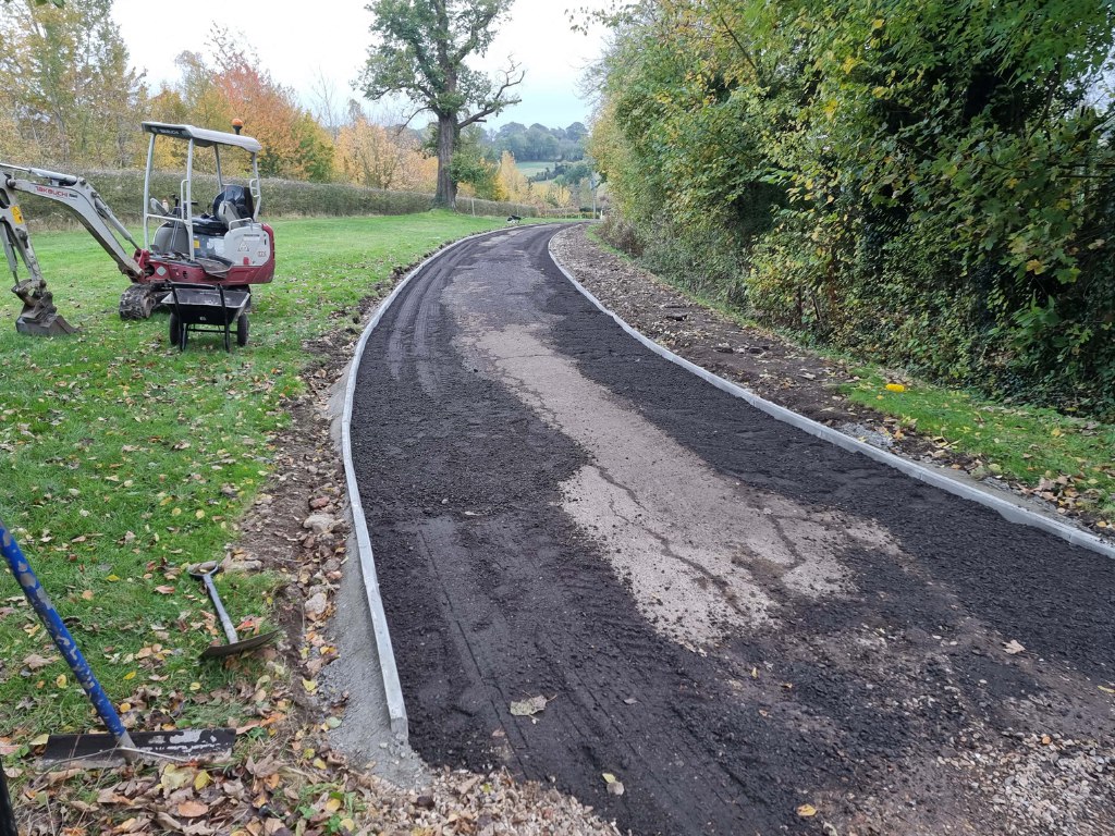 This is a large driveway which is in the process of having a tar and chip driveway installed on by NS Driveways Camberley